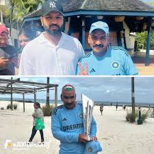 Sudhir Kumar Chaudhary, an ardent supporter, holds the T20 World Cup trophy and poses alongside Rohit Sharma